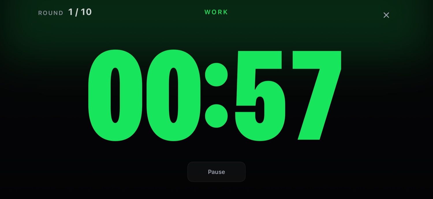 GRIT work timer — a huge green clock shown in landscape on the gym floor